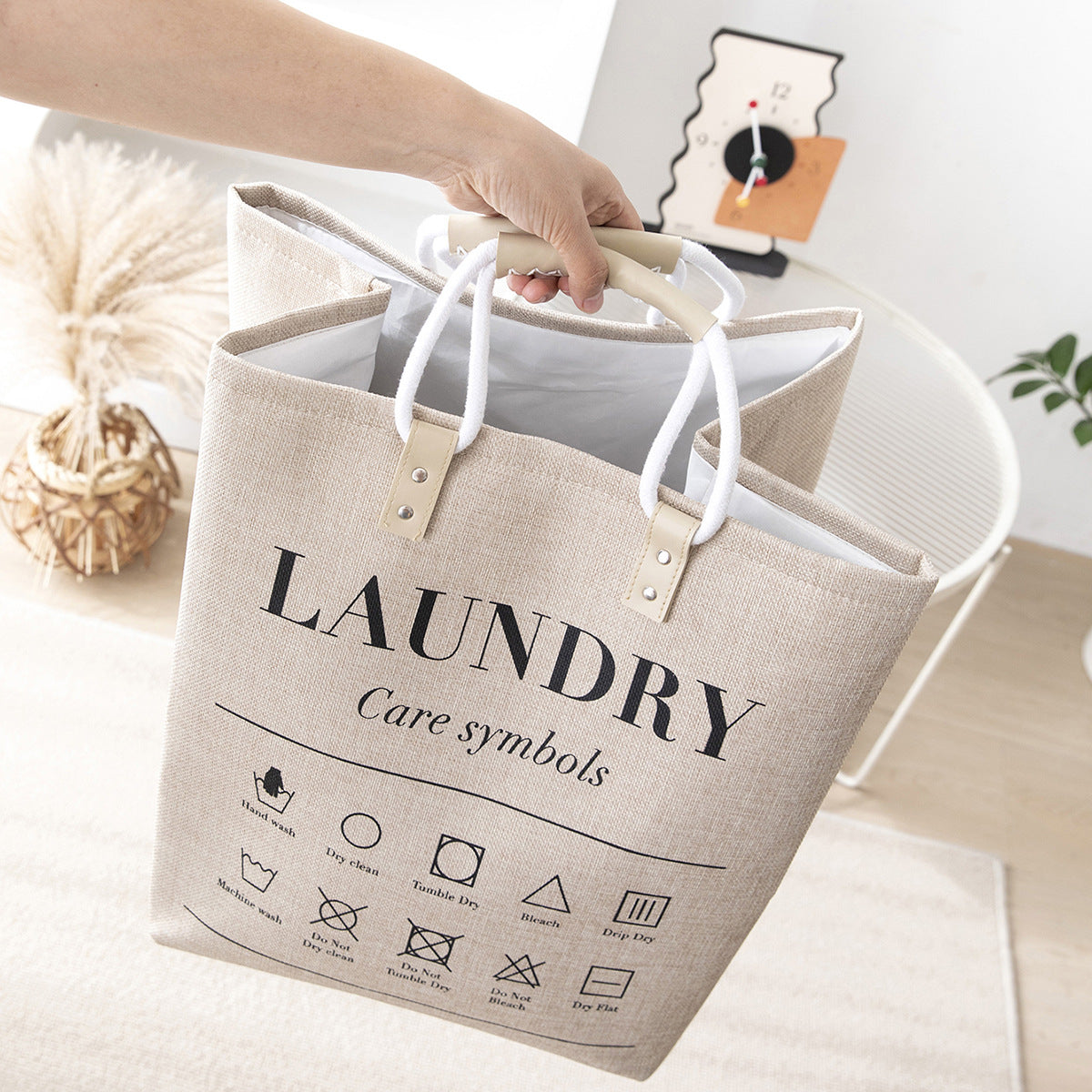 سلة غسيل قماشية مع رموز العناية ومقابض مزدوجة