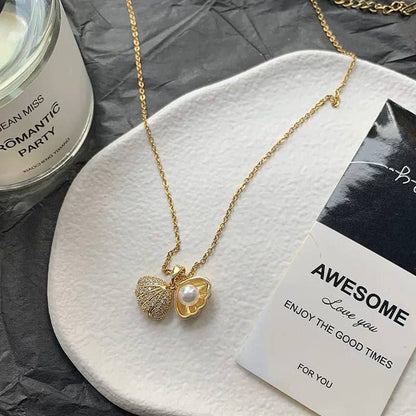 سلسلة ذهبية بدلاية صدفة ولؤلؤة وزركون على شكل قلب